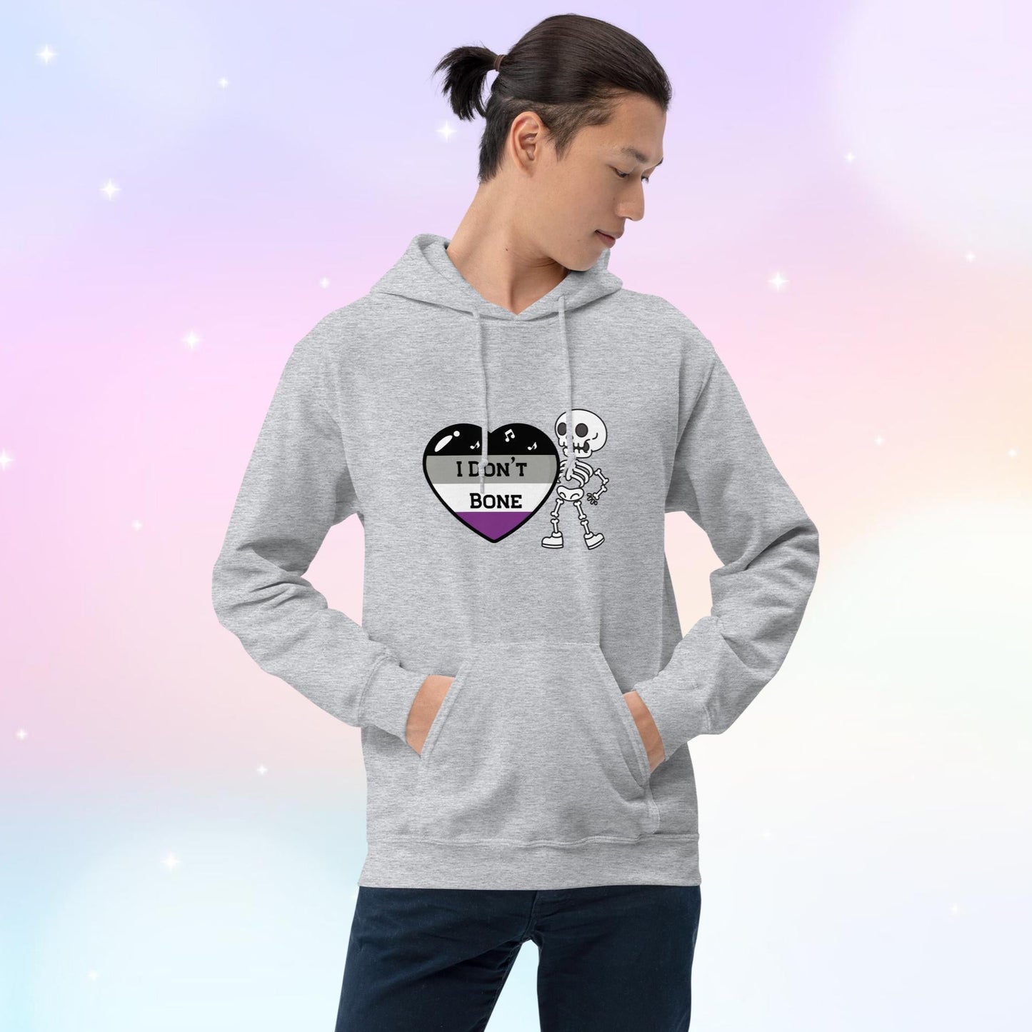 Asexual pride hoodie featuring a heart in asexual flag colors—black, gray, white, and purple—with the phrase 'I Don't Bone' in the center. A skeleton holds the heart, adding a playful yet bold design.