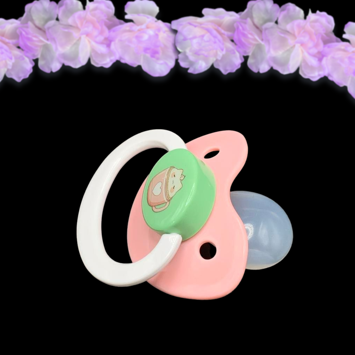 side view of adult pacifier with image on the button. Image is pink coffee mug with white heart and a marshmallow cat on top