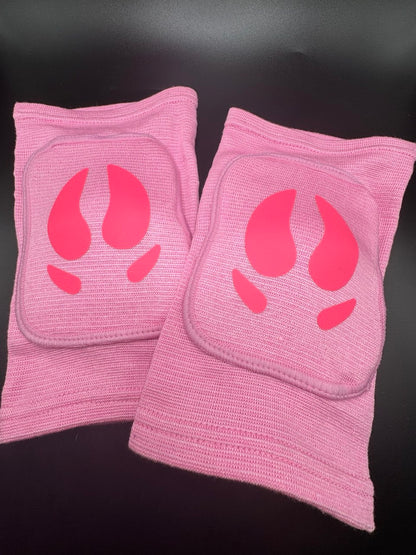 A pair of knee pads with pig hooves in the center for pig pet play