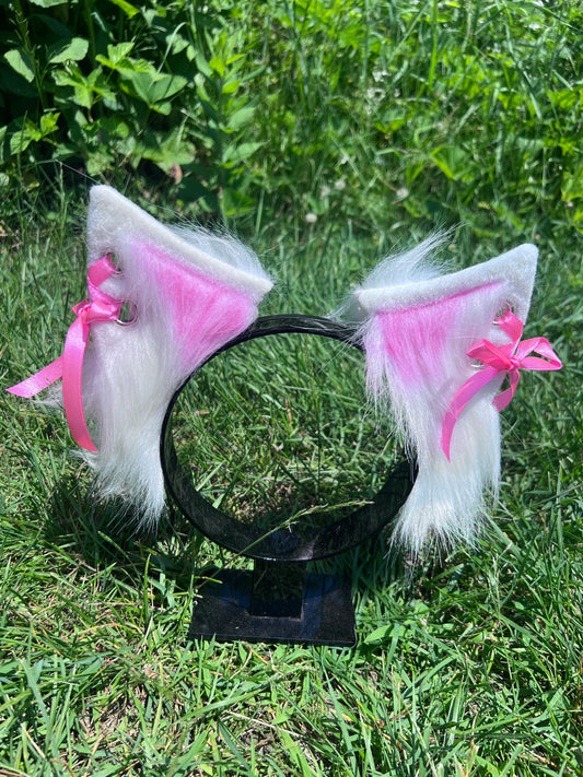 White Cosplay kitten ears featuring cute pink ribbon laced up the side and pink accent fur