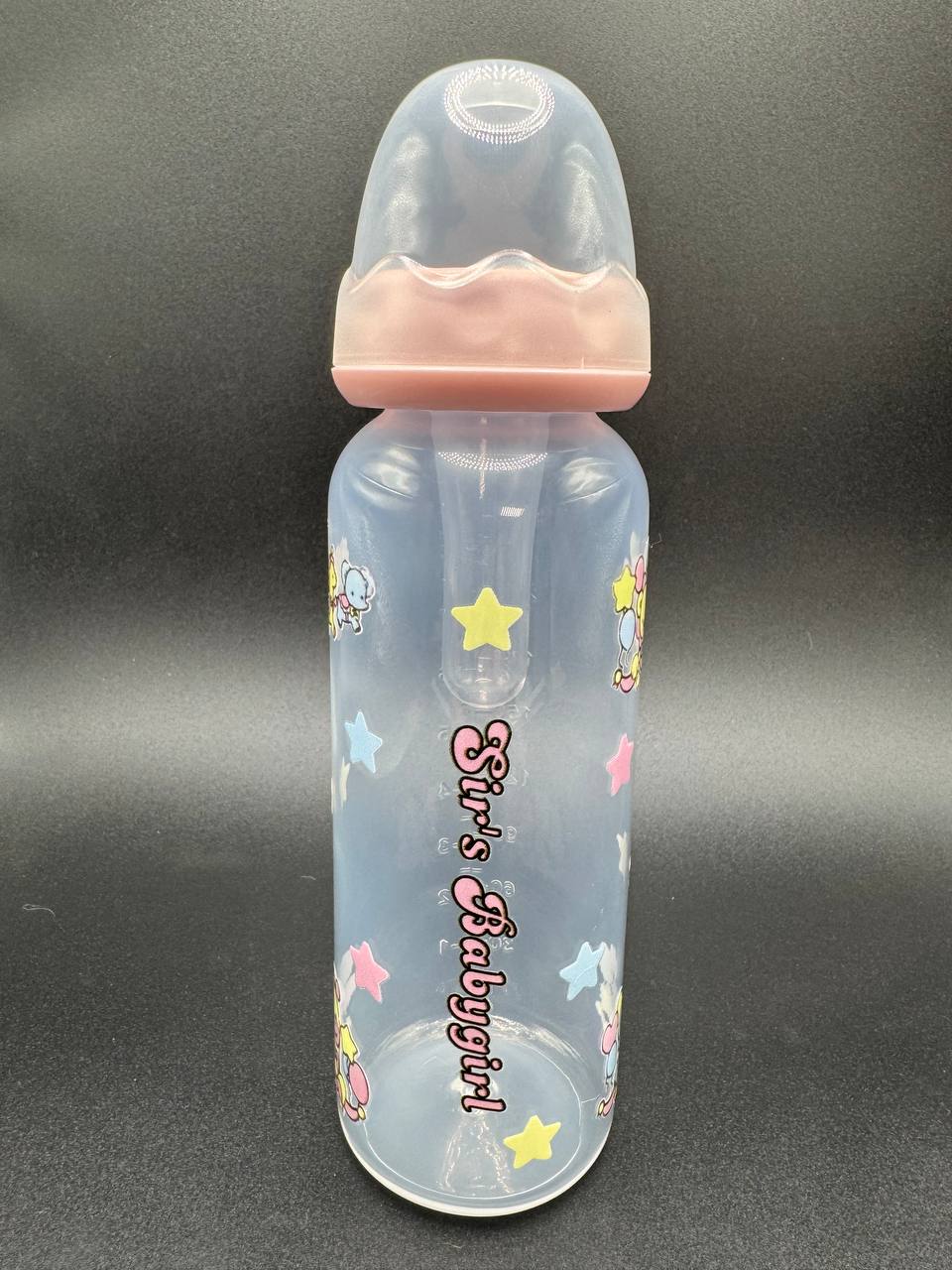 Baby bottle with pink cap and 'Sir's Babygirl' text on a dark background