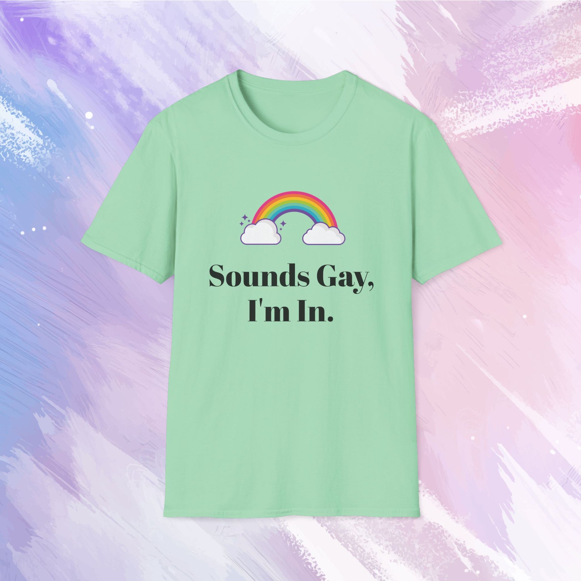 Shirt featuring a colorful rainbow with the text 'Sounds gay, I'm in' written in bold, playful font, celebrating LGBTQ+ pride and inclusivity.