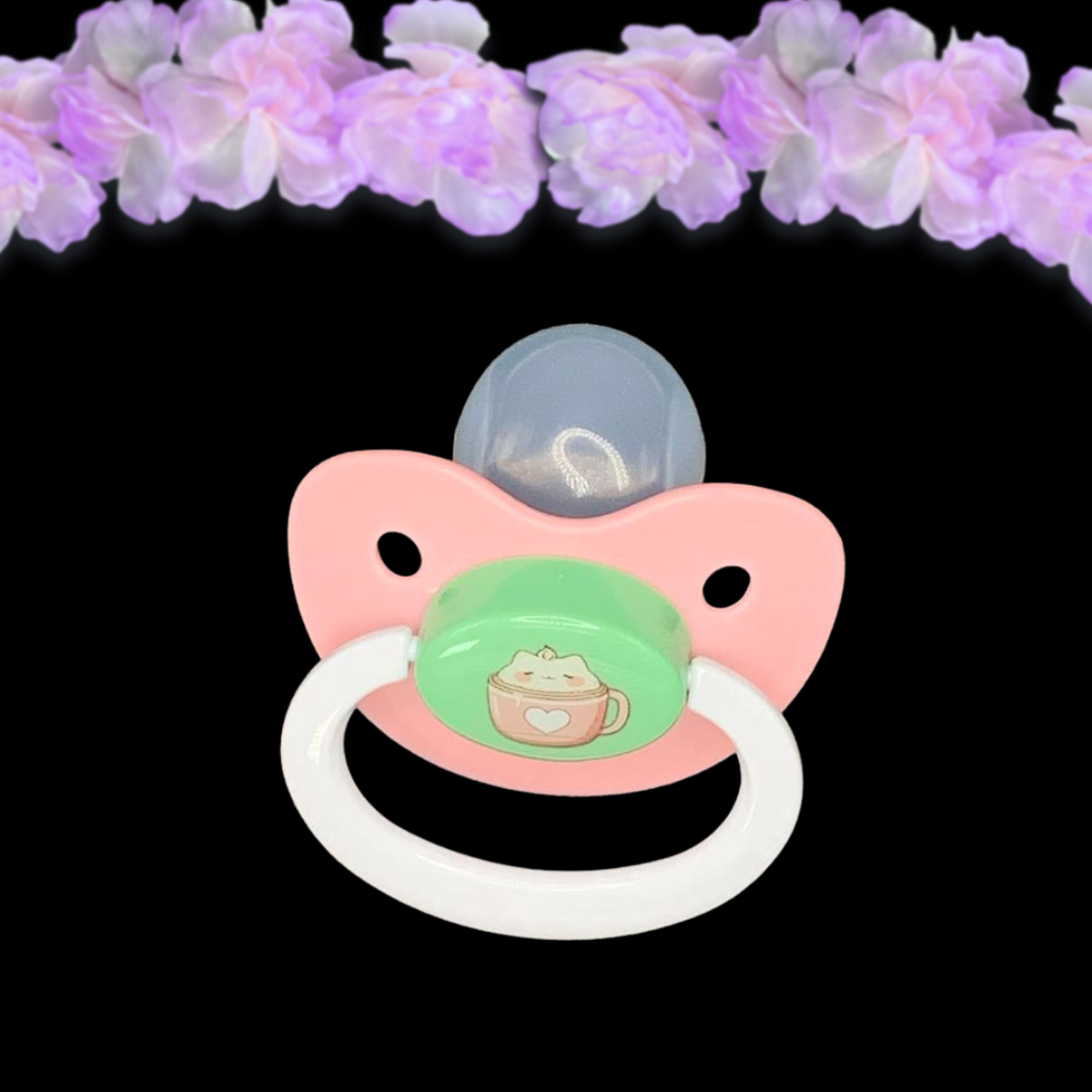 Pink, min and white Adult Pacifier with a cute hot cocoa mug and marshmallow cat image on the center button