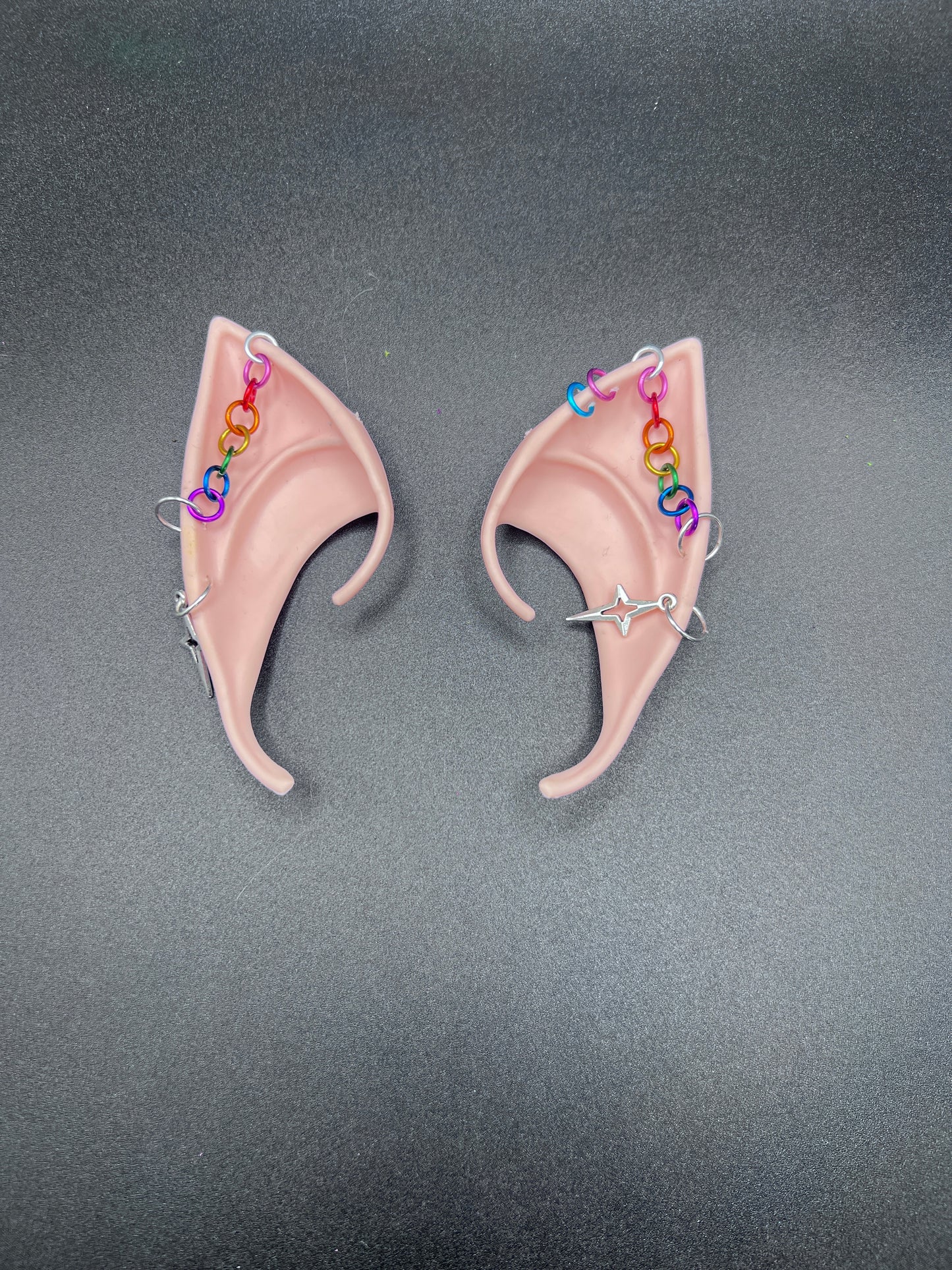 Cosplay fantasy elf ears with rainbow chain going across each ear and star dangling earrings