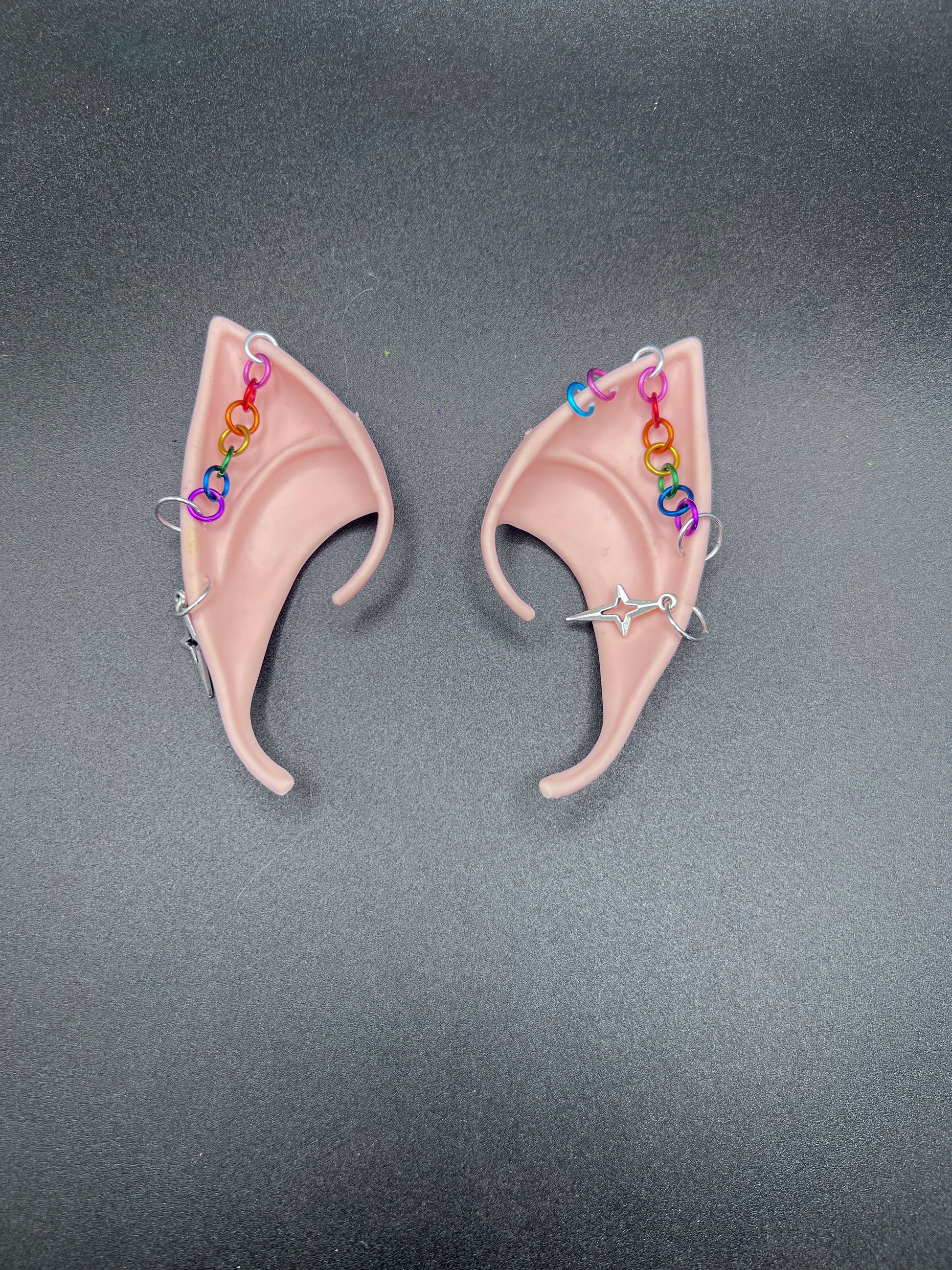 Cosplay fantasy elf ears with rainbow chain going across each ear and star dangling earrings