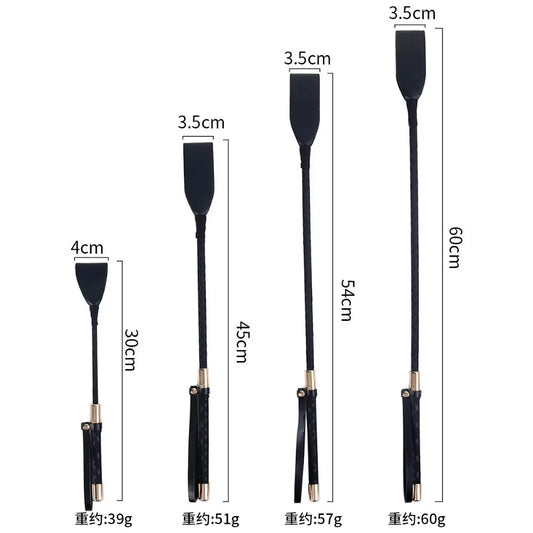 A black leather impact play riding crop featuring sleek silver accents, combining durability with an elegant and edgy design.