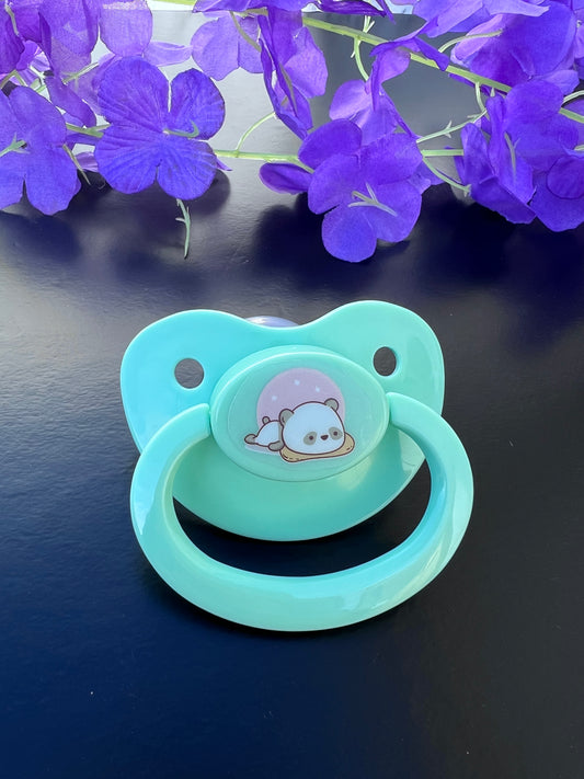 mint adult pacifier featuring a cute sleepy panda