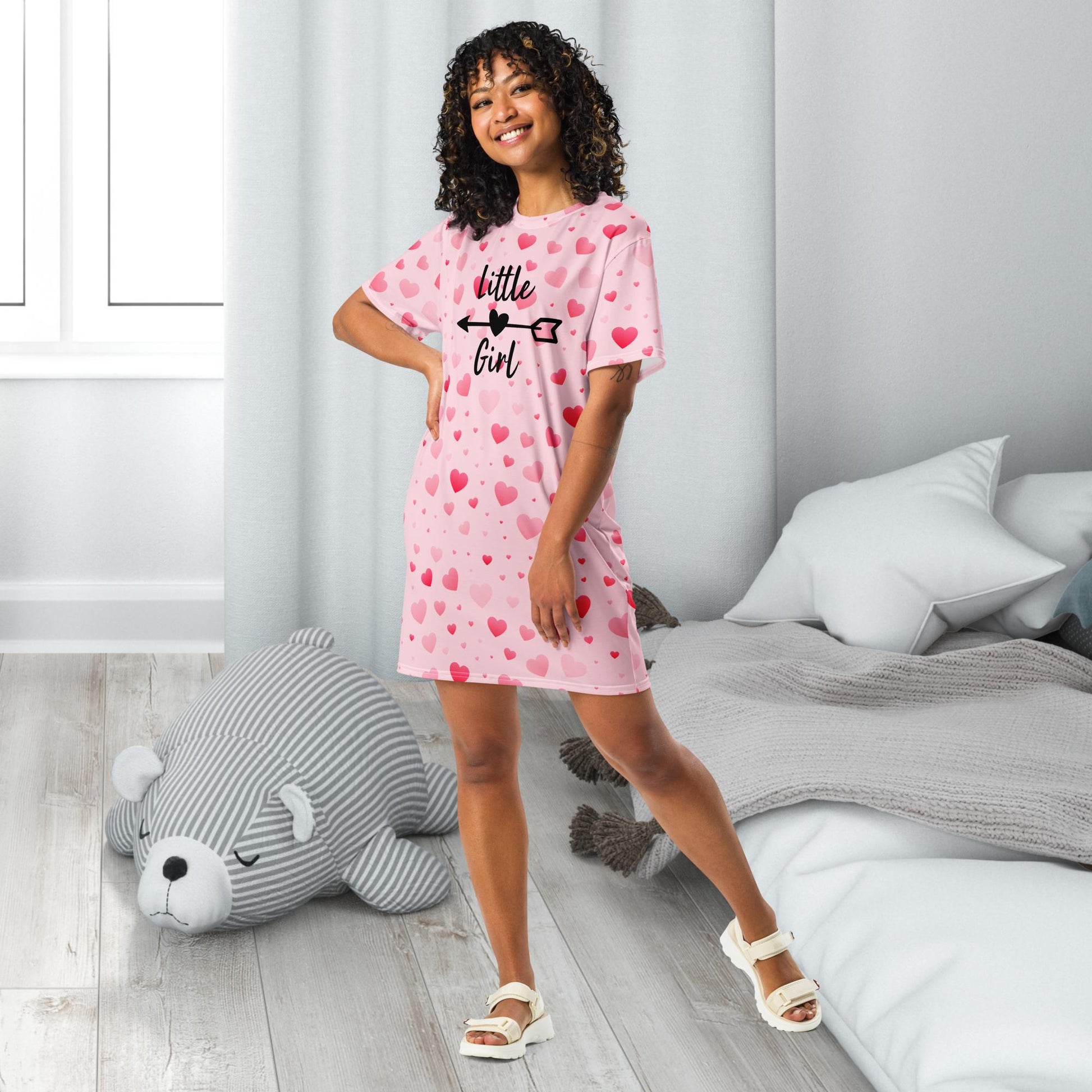 A pink adult nightgown covered in red hearts, featuring the text "Little Girl" in elegant lettering, creating a sweet and playful bedtime look.