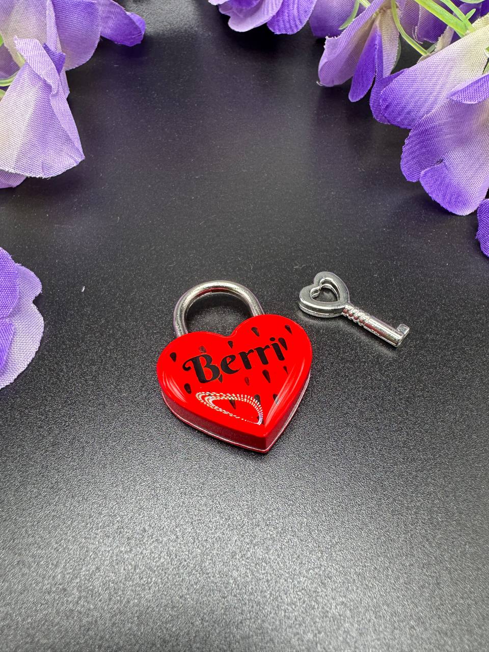 Red heart-shaped lock with 'Berri' branding and a key