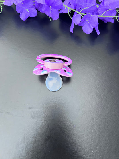 baby pink adult binkie with hand painted design of clouds and puppy center