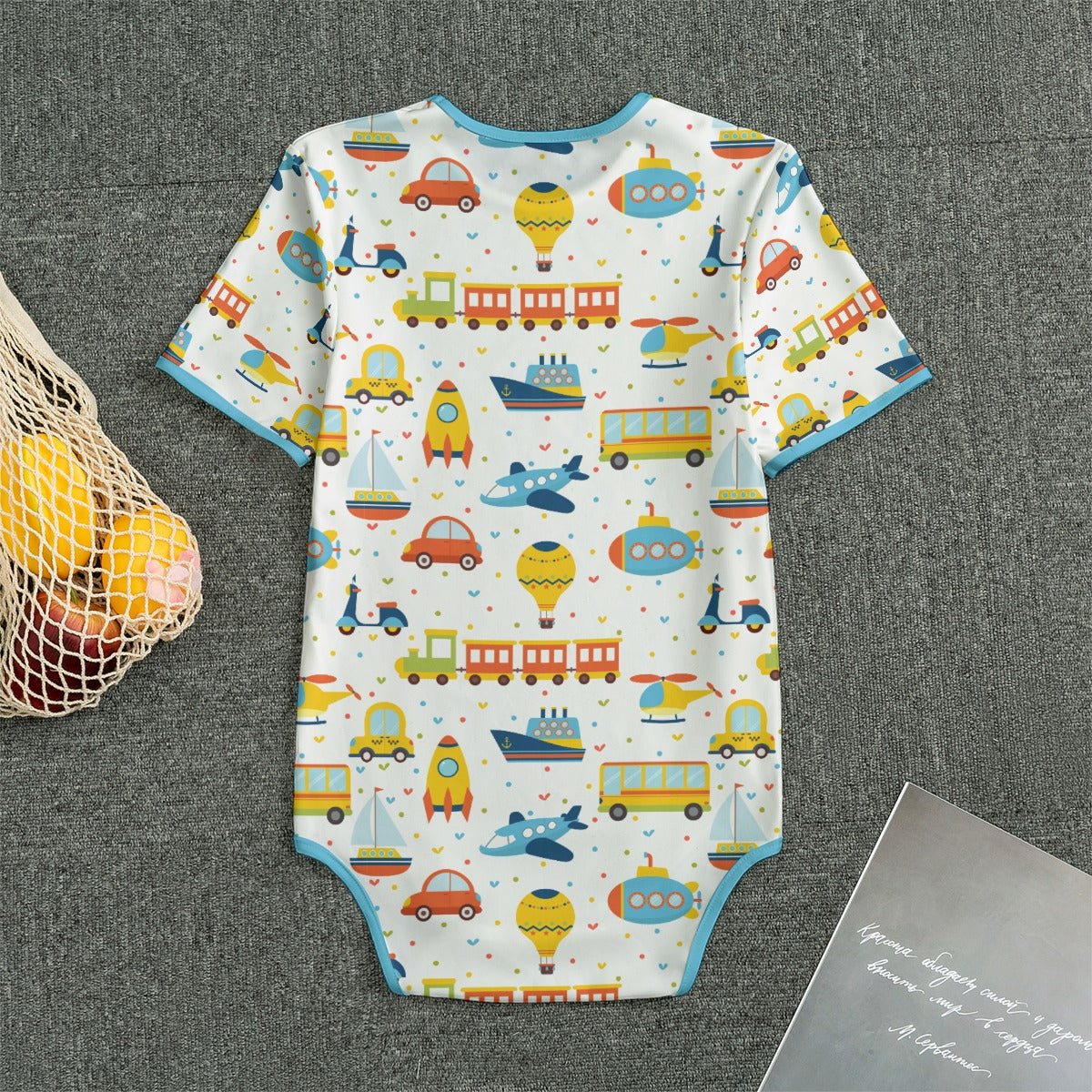 ABDL onesie with transportation-themed print with blue trim