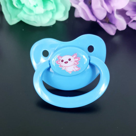 baby blue adult pacifier with kawaii pink axolotl center