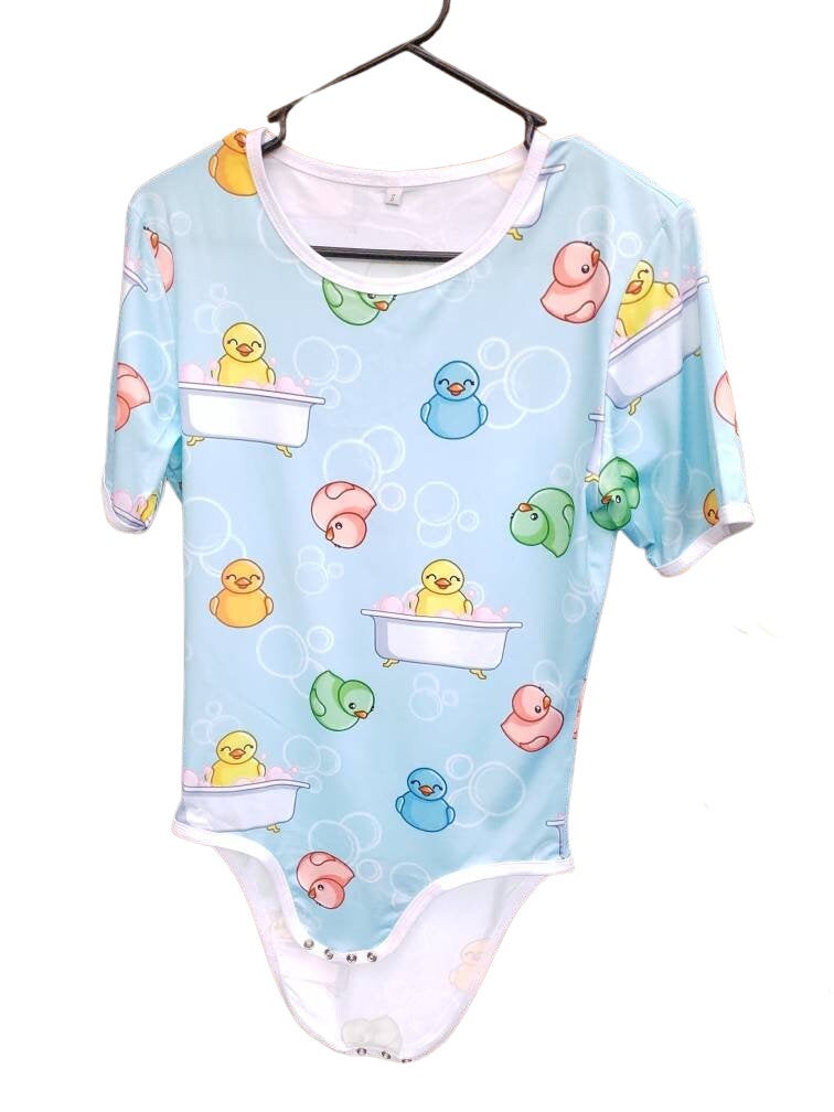 A blue adult baby onesie featuring a playful design with rubber ducks and bubbles, creating a cheerful and bath-time-inspired theme.