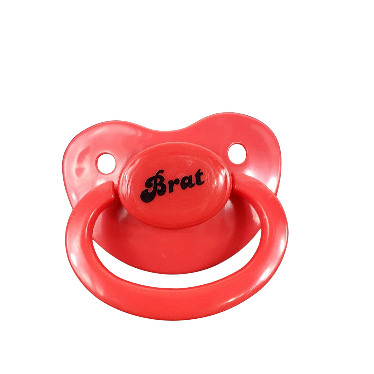 red adult pacifier with the text Brat in the center