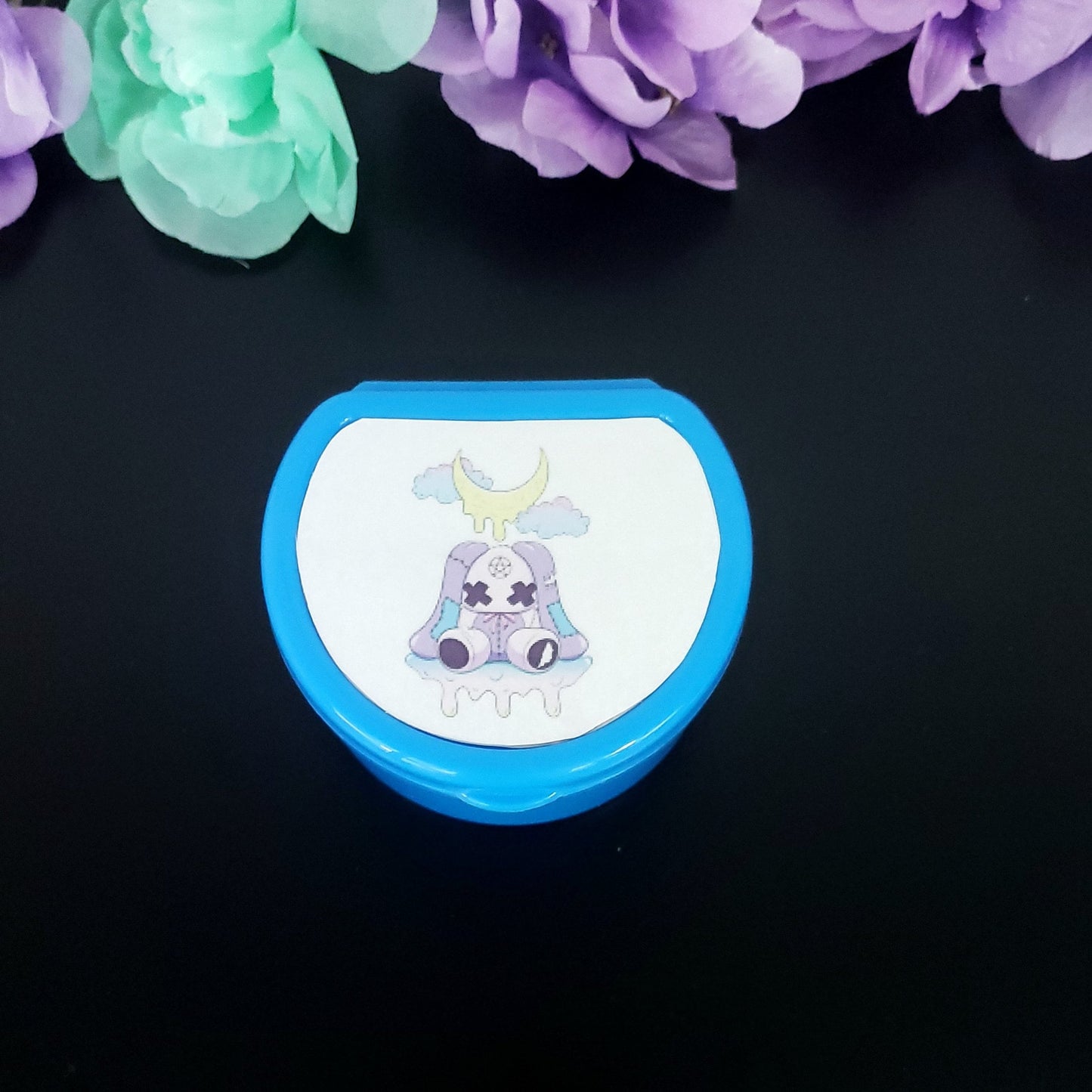 Dark Blue ABDL pacifier case featuring a creepy kawaii purple bunny with dripping moon and pastel clouds