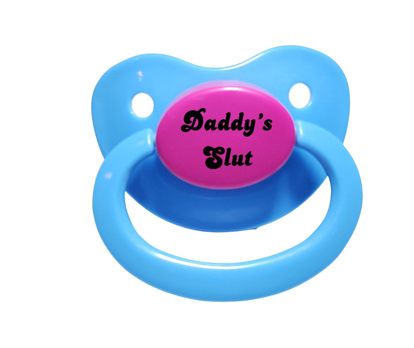 A baby blue and hot pink adult pacifier with bold text in the center that reads "Daddy's Slut," featuring a vibrant and edgy design.