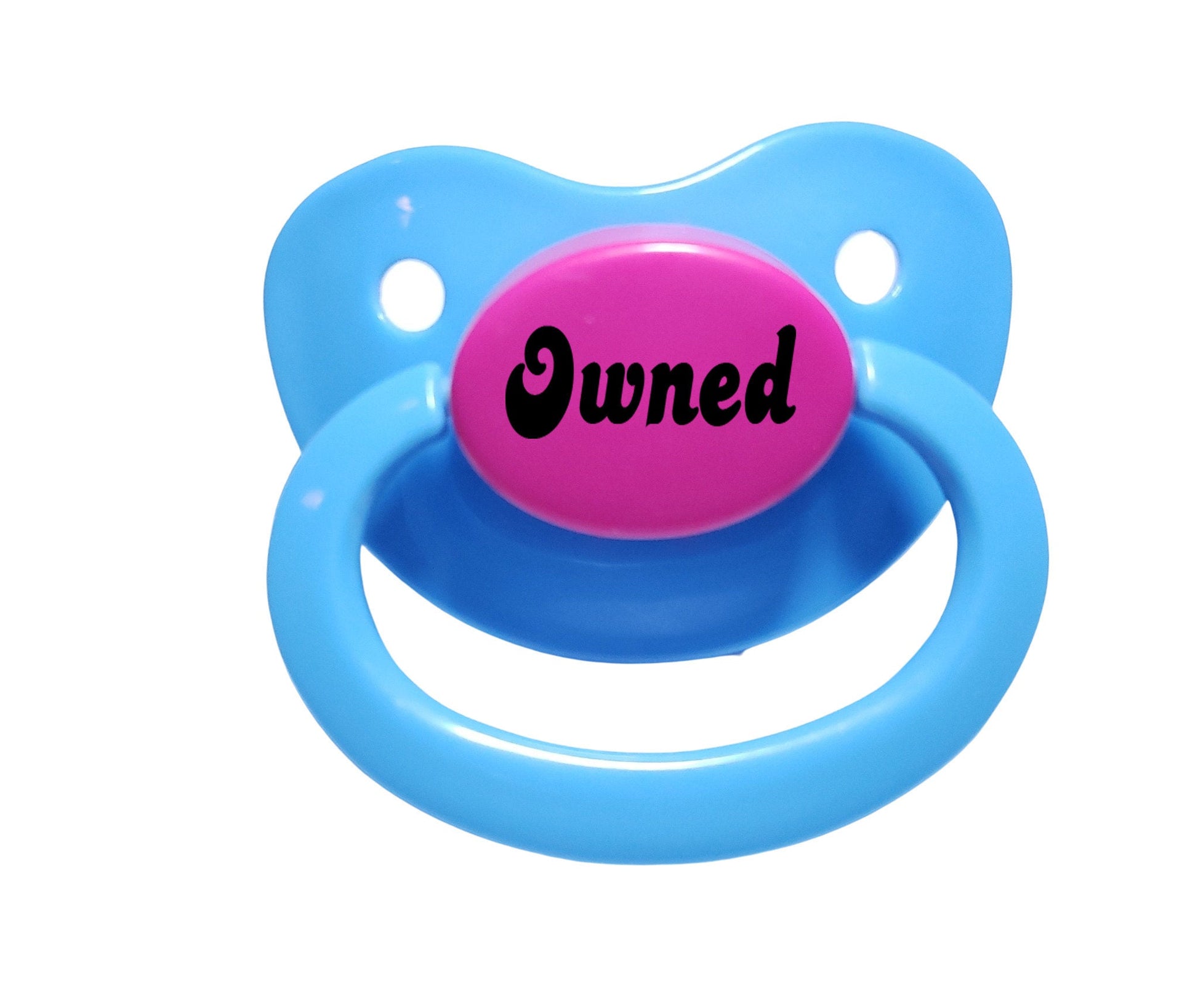 A baby blue and hot pink adult pacifier with elegant black text in the center that reads "Owned," featuring a soft and playful design.