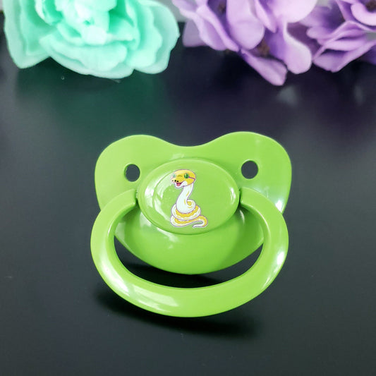 green adult pacifier with a yellow and white snake on the center button