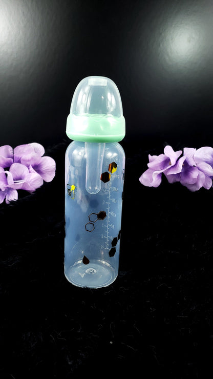 An 8oz ABDL bottle featuring a cheerful bee theme, with cute bees, honeycombs, and vibrant honey gold accents wrapping around the bottle for a playful and whimsical design.