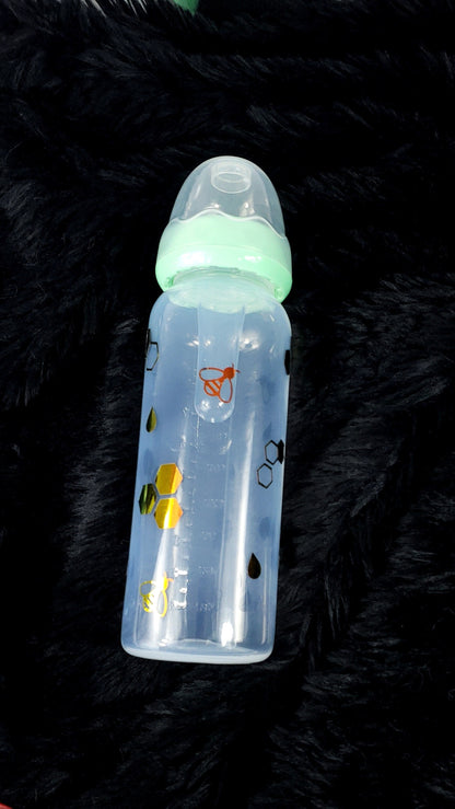 An 8oz ABDL bottle featuring a cheerful bee theme, with cute bees, honeycombs, and vibrant honey gold accents wrapping around the bottle for a playful and whimsical design.