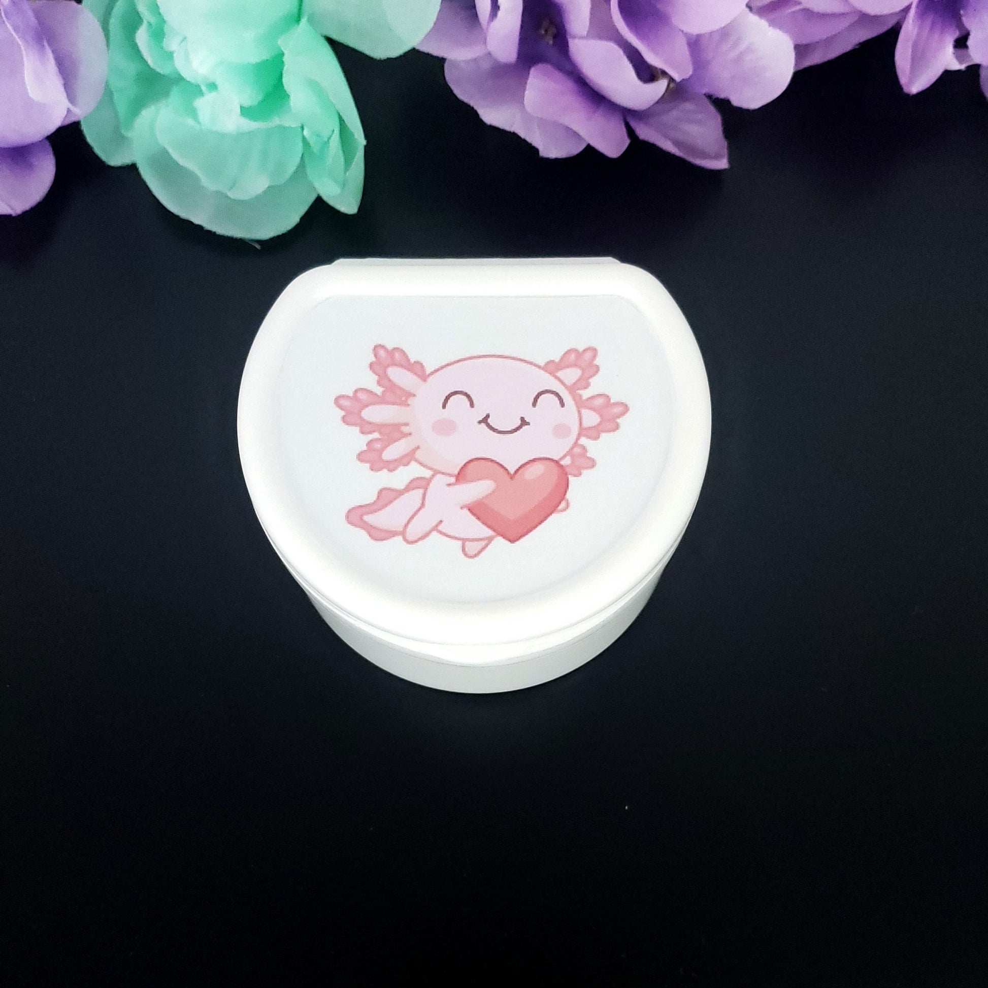 white adult pacifier case with kawaii pink axolotl holding a heart