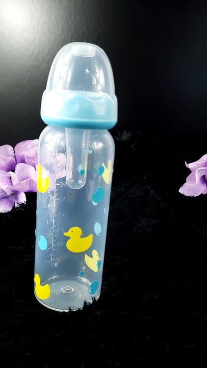 An 8oz adult baby bottle featuring a playful design with yellow ducks and blue bubbles, creating a fun and whimsical bath-time-inspired theme.