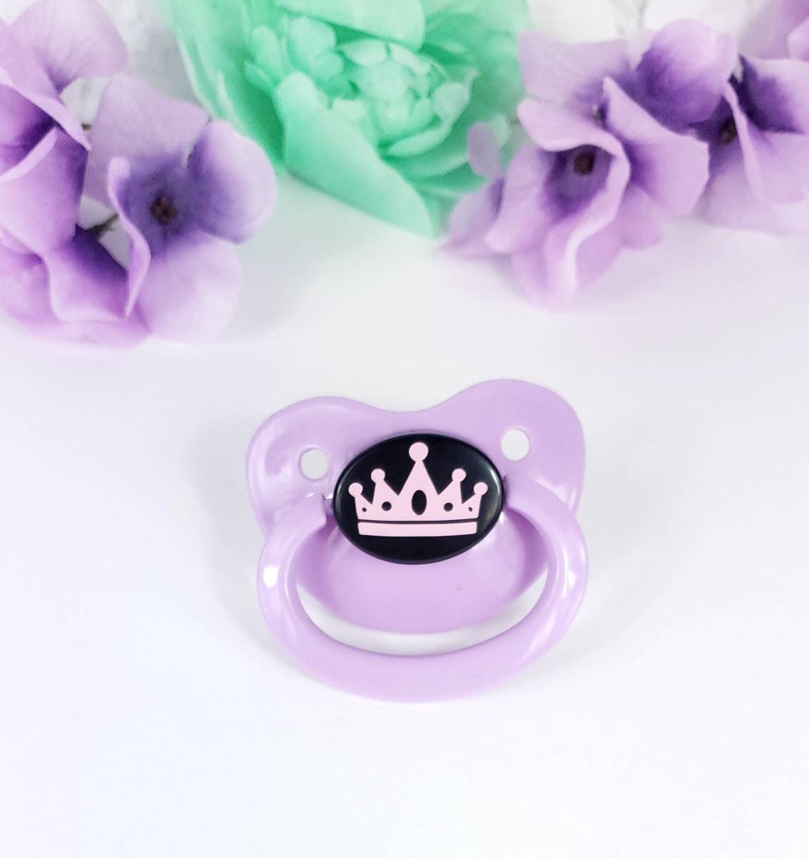 adult pacifier with a crown or tiara center that can be any color you wish