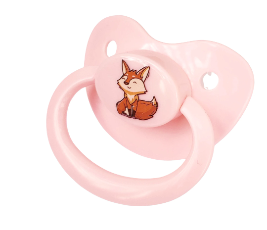 baby pink adult pacifier with smiling fox image on button