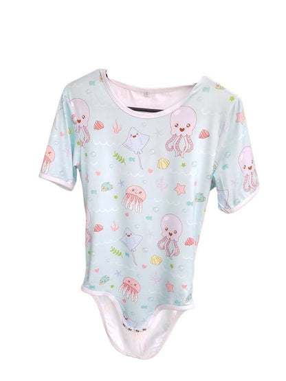 Adult bodysuit featuring colorful ocean creatures, including fish, jellyfish, stingrays, octopus and coral designs, perfect for a fun and cozy underwater-inspired look.