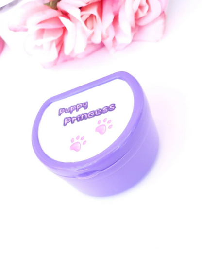 Adult pacifier case featuring the text 'Puppy princess' on the lid with cute paw print accents, designed for stylish and convenient pacifier storage.